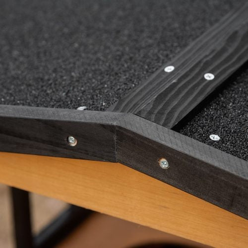 Close up of asphalt shingle roof and wood frame screws on cat house